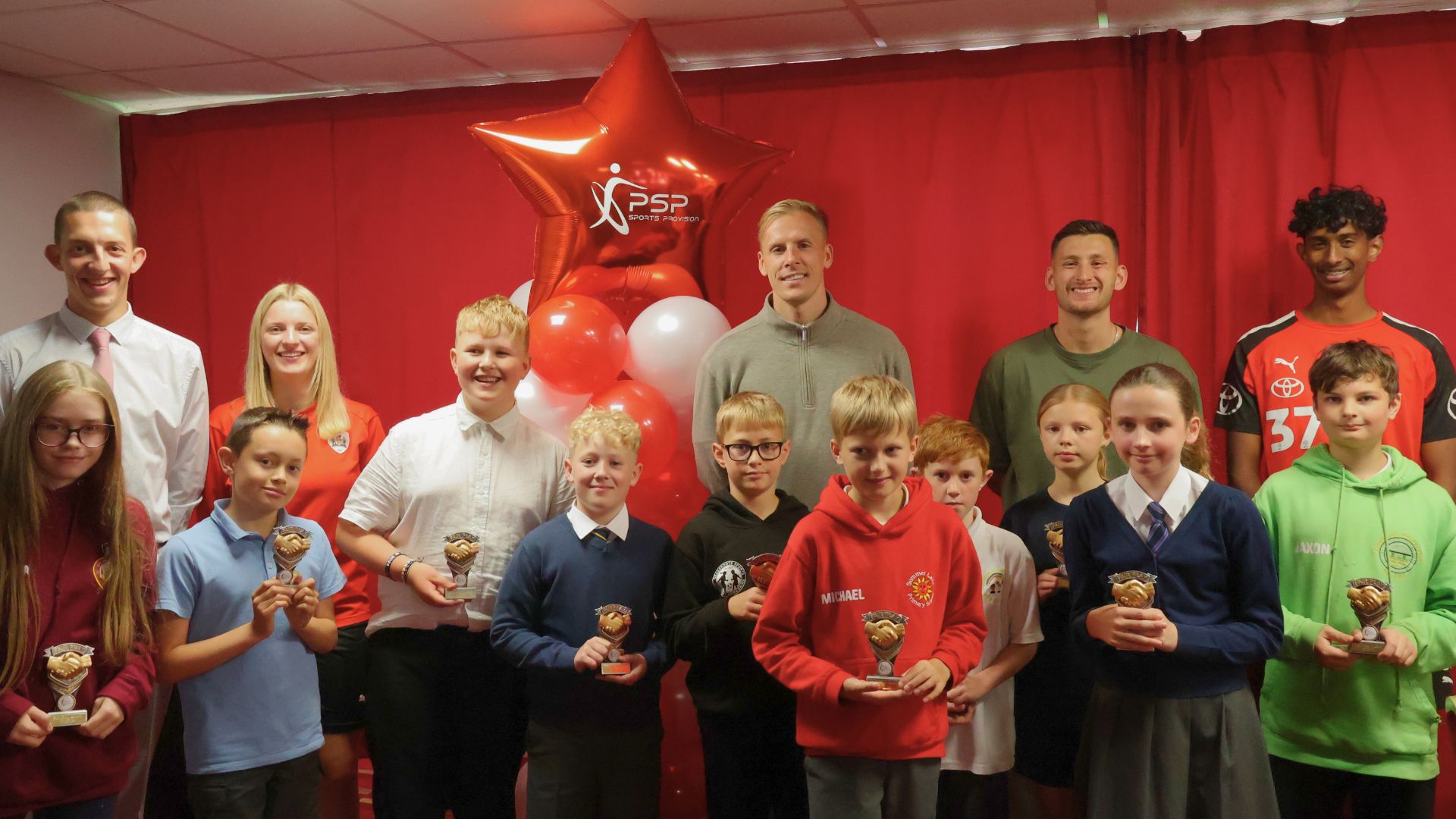 Barnsley FC players, Vimal Yoganathan, Marc Roberts, and Jackson Smith join celebration at the Pro-Active School Performance Sports Awards Ceremony.