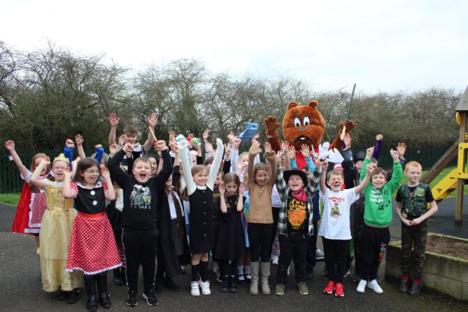 Reds in the Community give free books to local primary school pupils