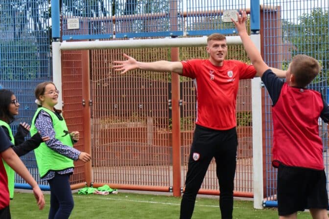 Barnsley FC’s Rogan Ravenhill joins PE at Holy Rood Catholic Primary School